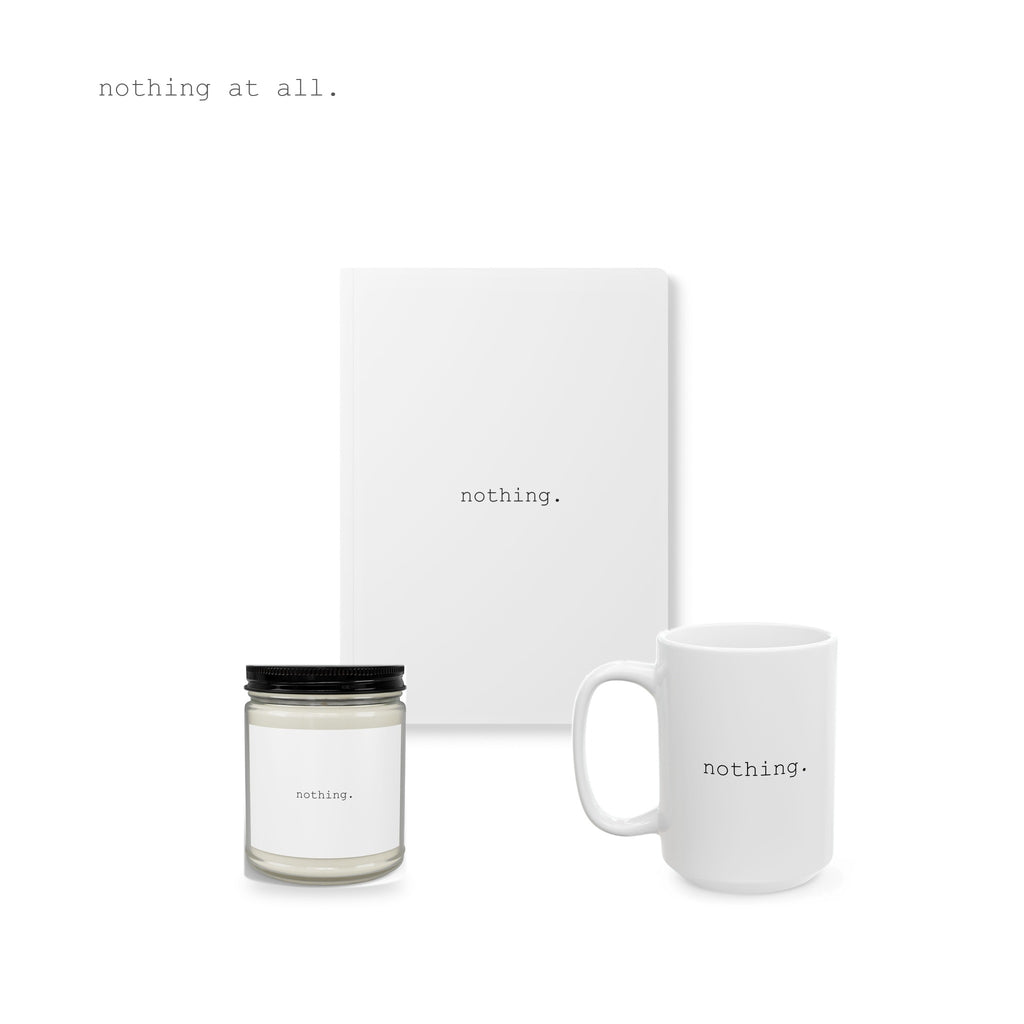 A candle, a journal and a mug, together