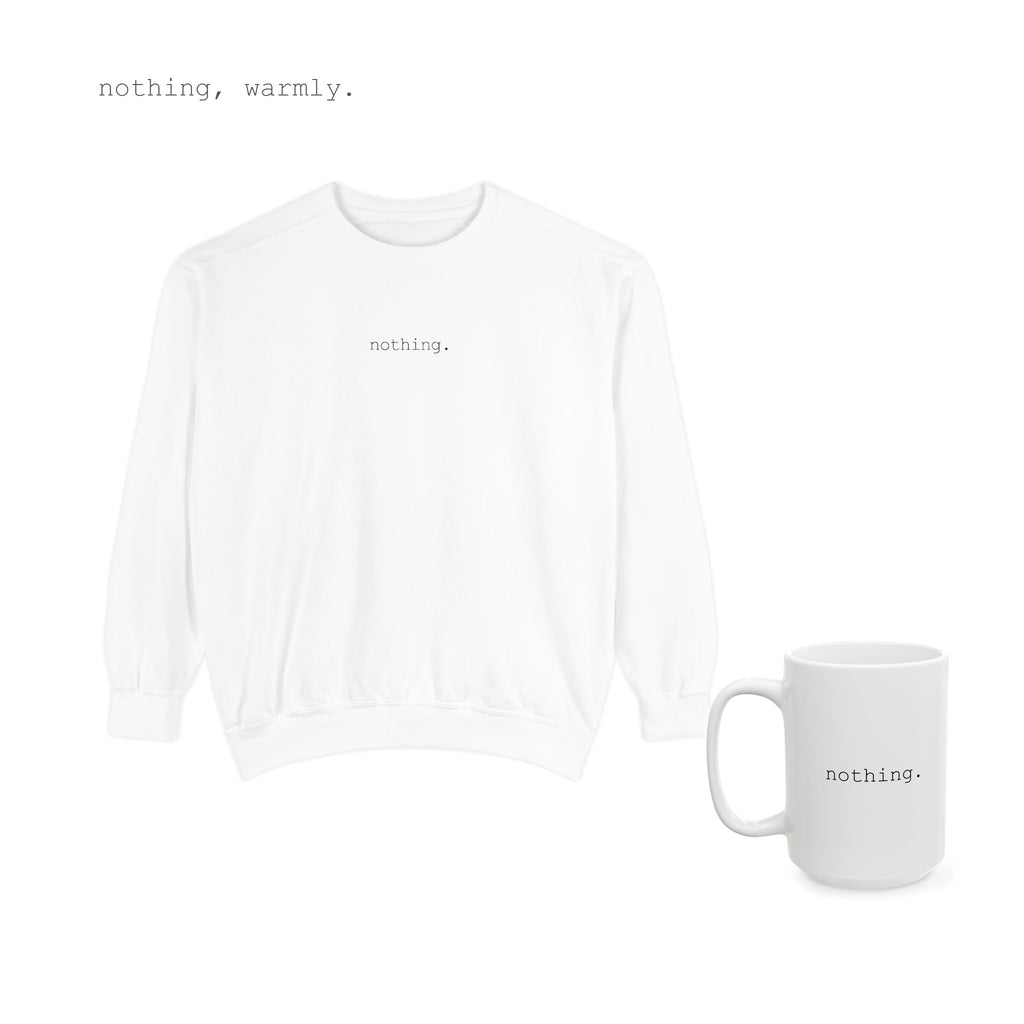 A white sweater and a mug, together